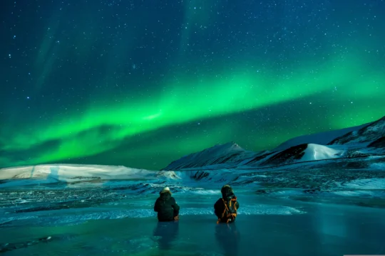 Aurora Borealis lighting up the sky over Iceland’s landscape