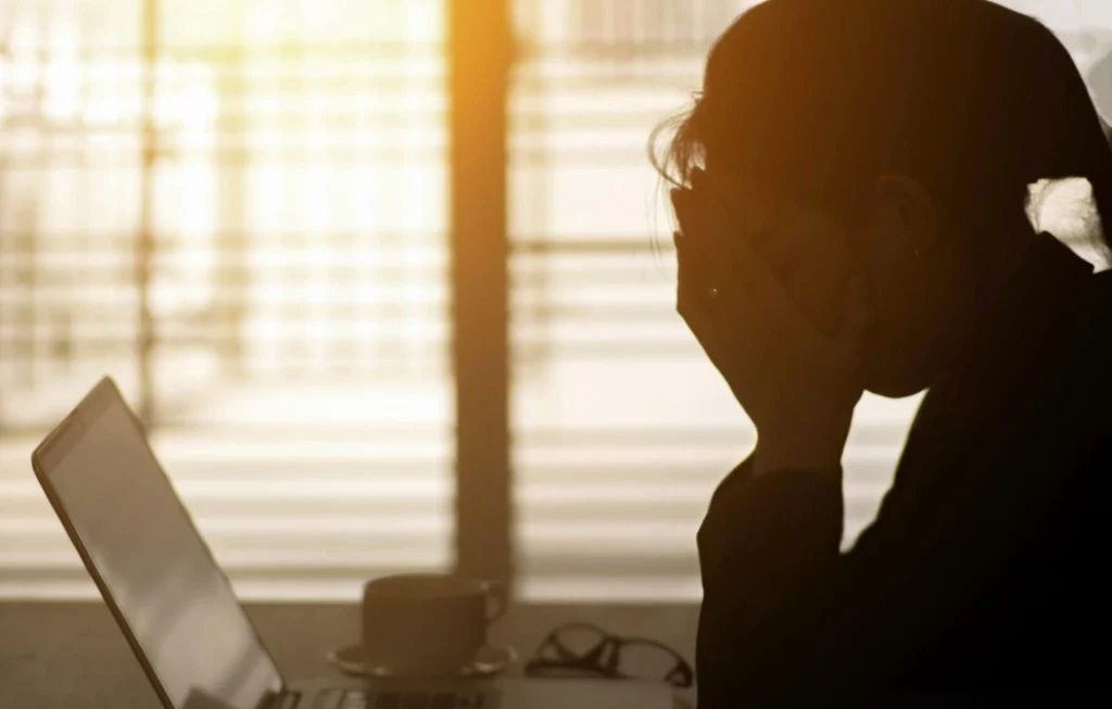 A student facing challenges while working online, highlighting solutions for overcoming difficulties in work-from-home jobs for students in India.